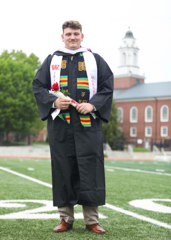 a man in a graduation gown