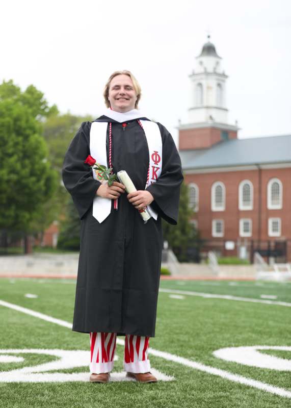 a man in a graduation gown