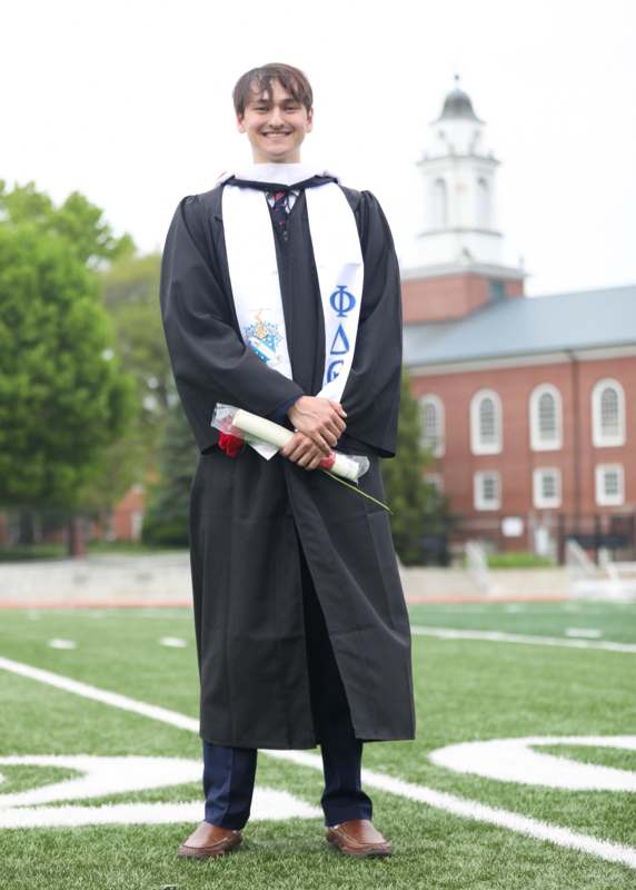 a man in a graduation gown