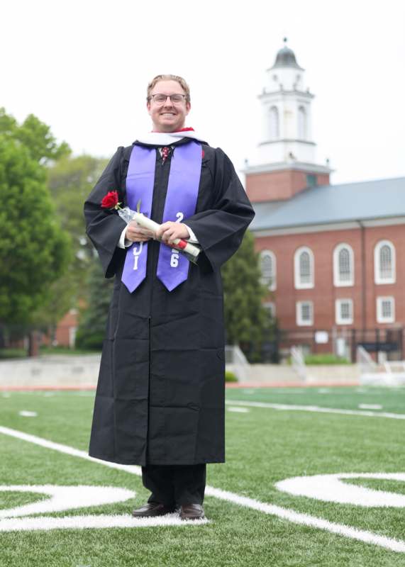 a man in a graduation gown