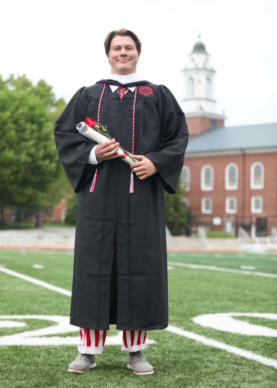 a man in a graduation gown