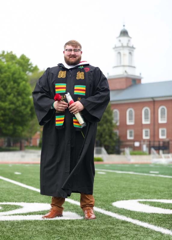 a man in a graduation gown