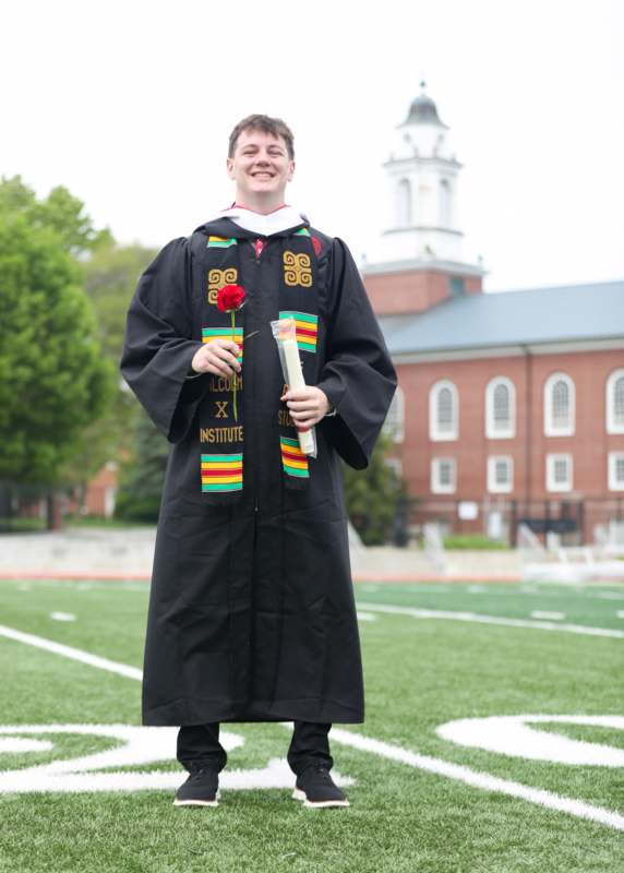 a man in a graduation gown