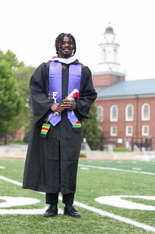 a man in a graduation gown