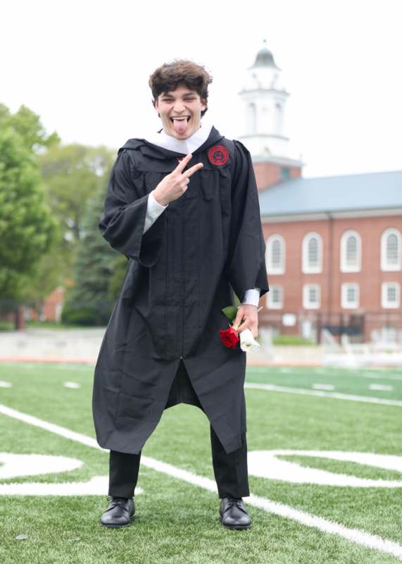 a man in a graduation gown