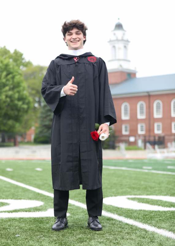 a man in a graduation gown