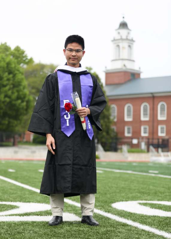 a man in a graduation gown