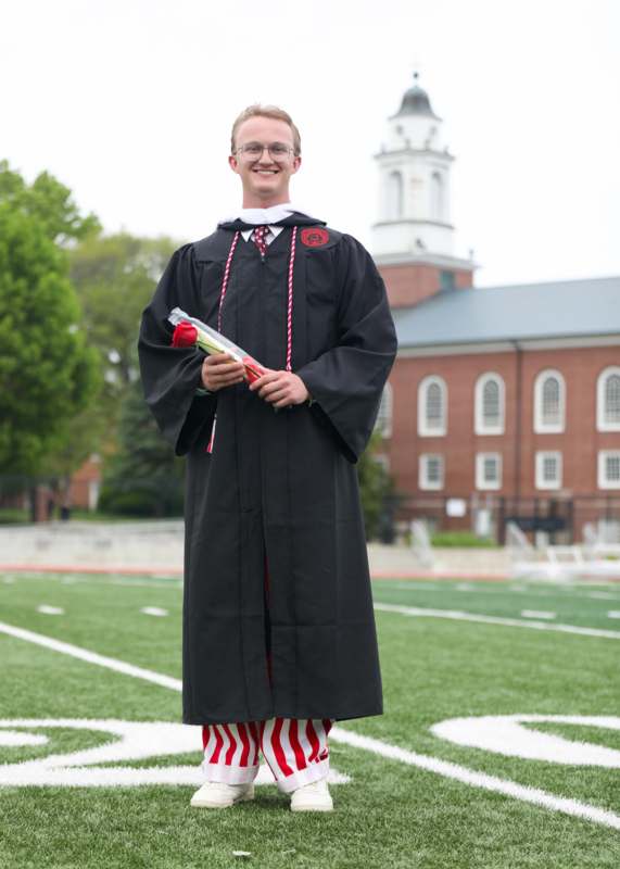 a man in a graduation gown