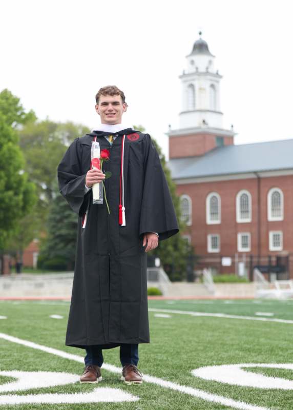 a man in a graduation gown
