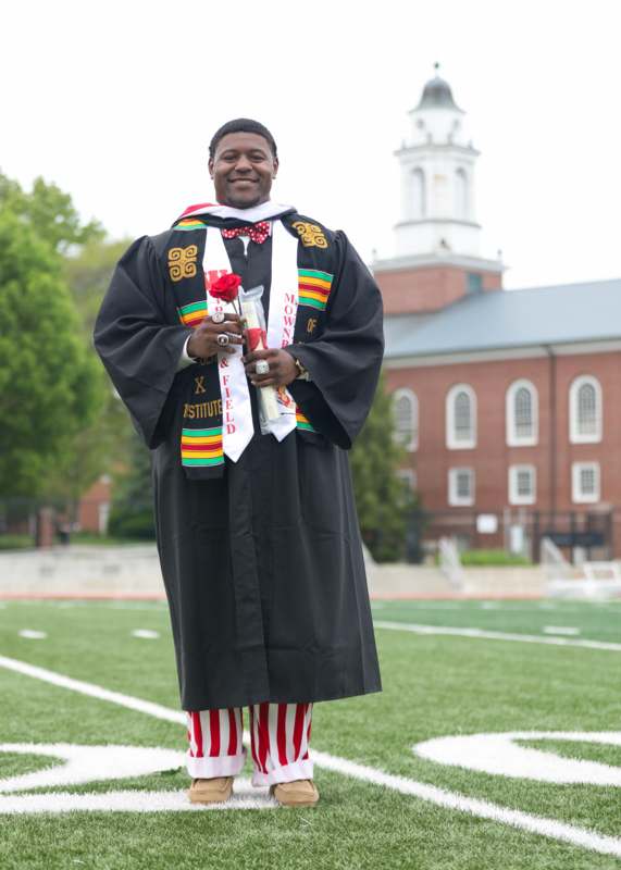 a man in a graduation gown