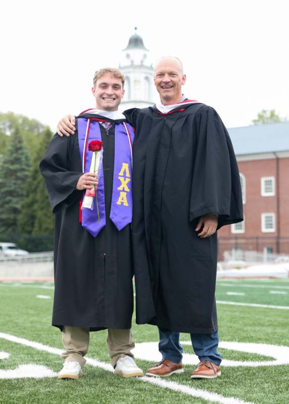 two men in graduation gowns