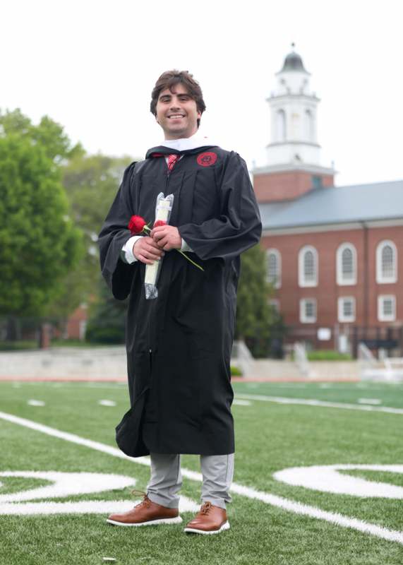a man in a graduation gown