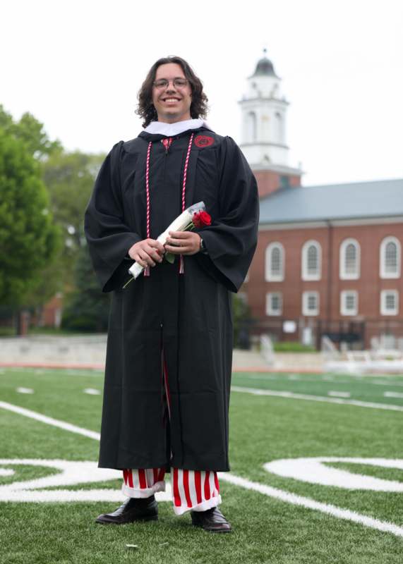 a man in a graduation gown