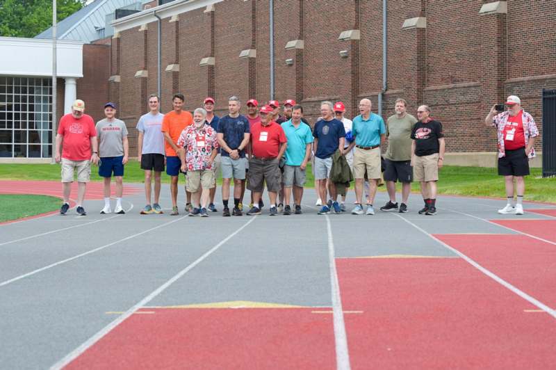 a group of people standing on a track