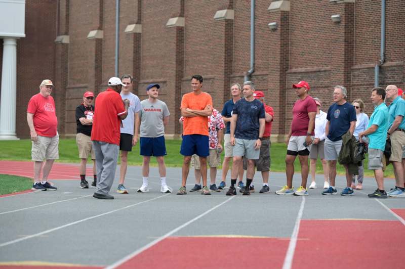 a group of people standing on a track