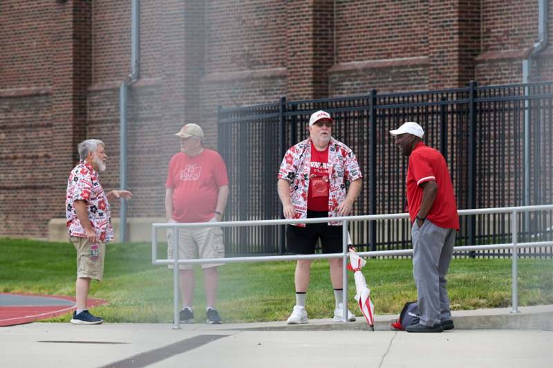 a group of men standing outside