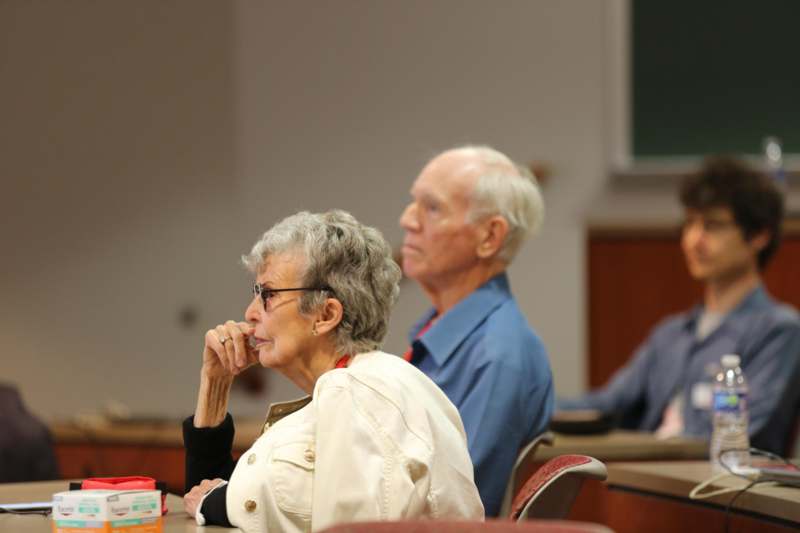 a man and woman sitting at a table