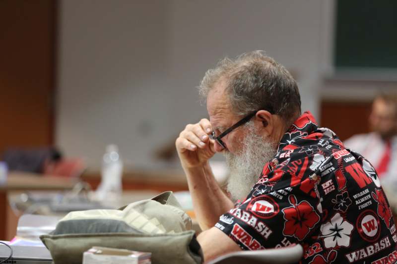 a man with a beard and glasses