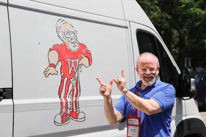 a man standing in front of a truck