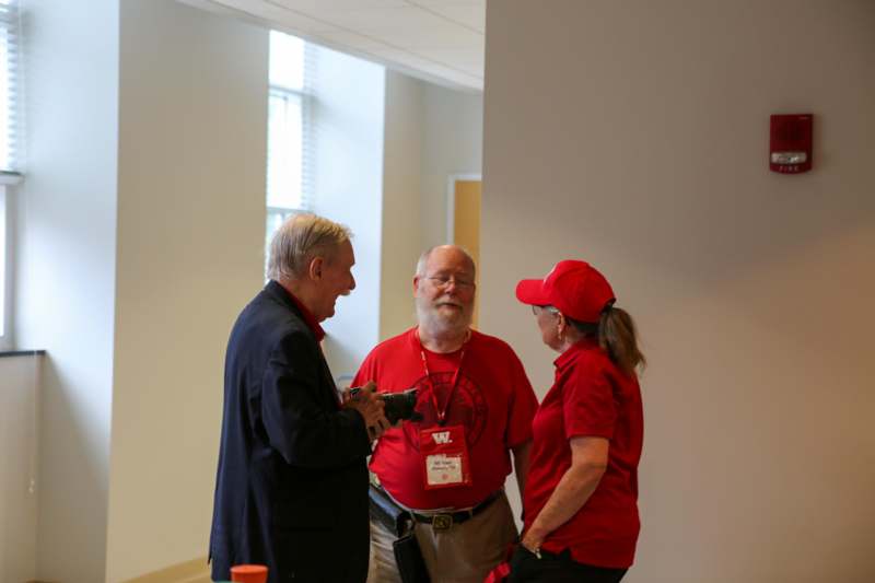 a group of people standing in a room