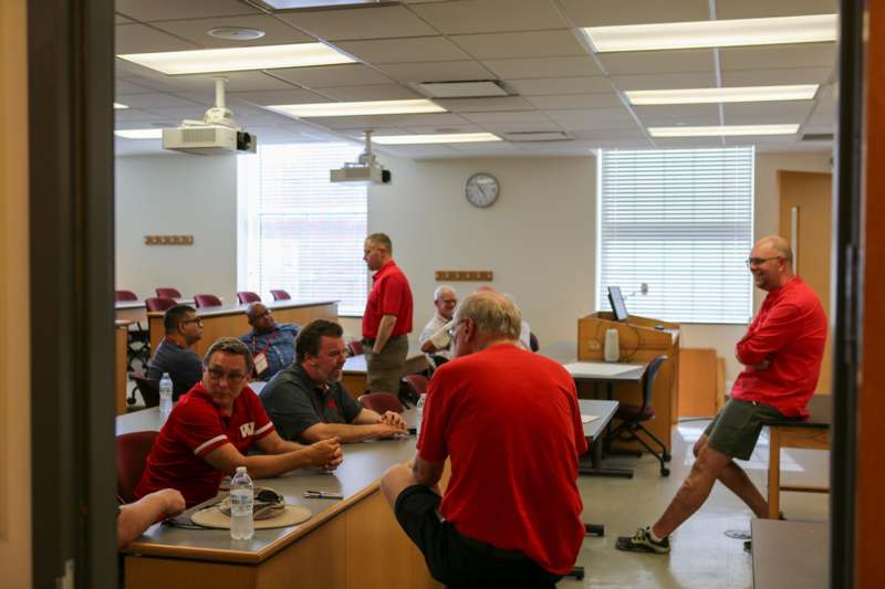 a group of people sitting at tables in a room