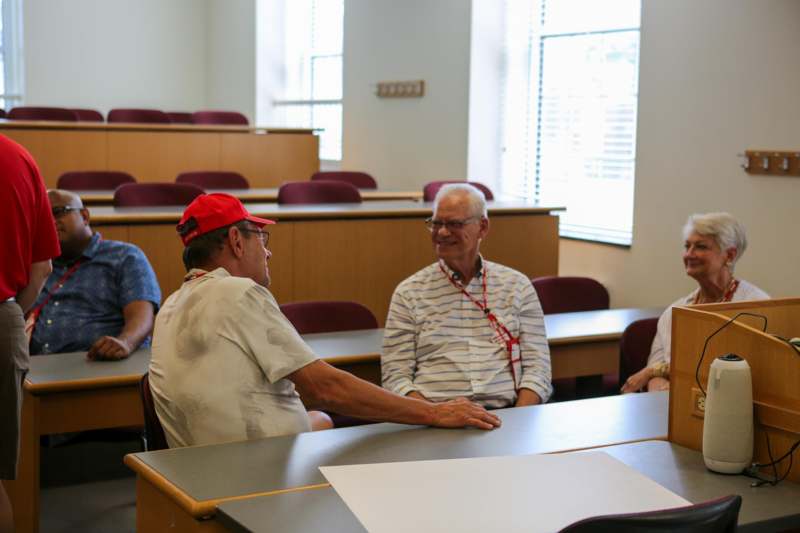 a group of people sitting at tables