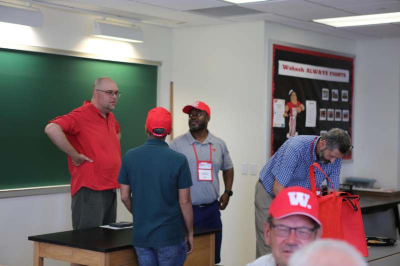 a group of men in a classroom