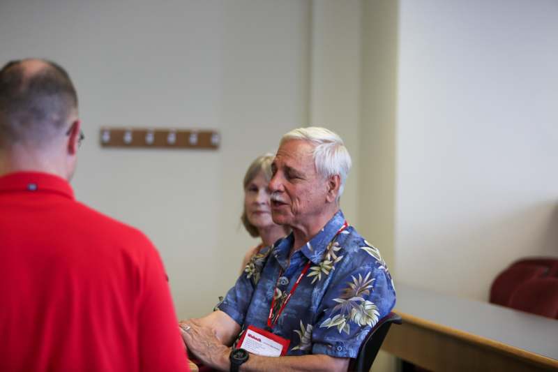 a man talking to a woman