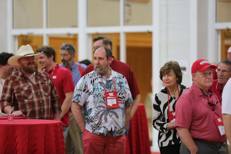 a group of people standing in a room