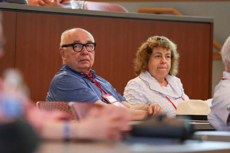 a man and woman sitting in chairs