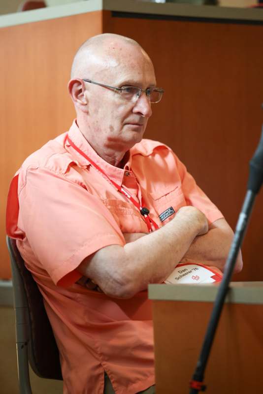 a man in an orange shirt