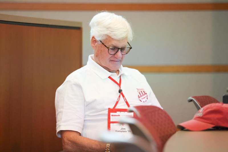 a man wearing a white shirt and glasses