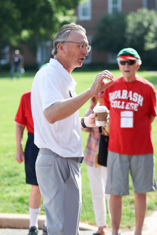 a man holding a coffee cup