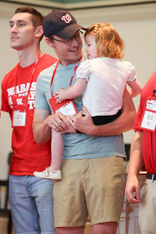 a man holding a child