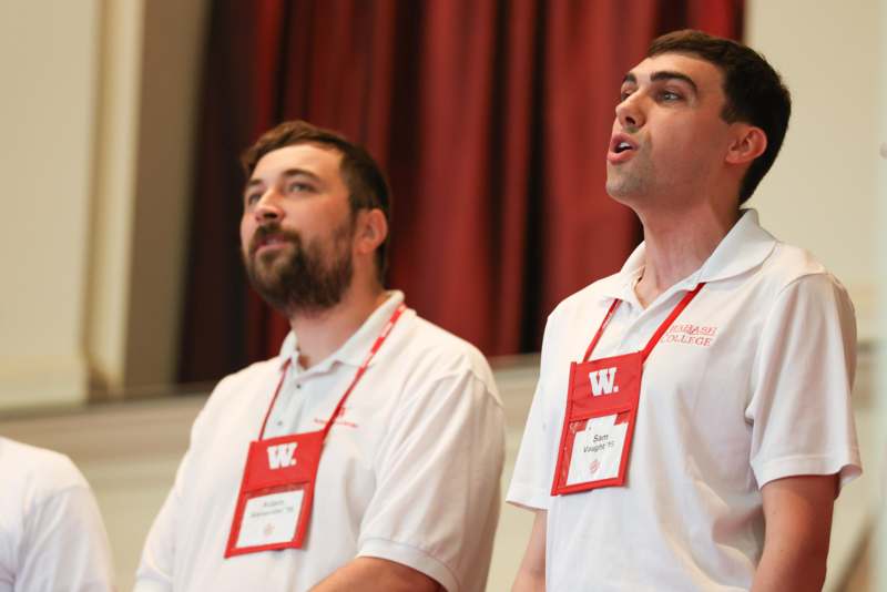 a group of men wearing name tags