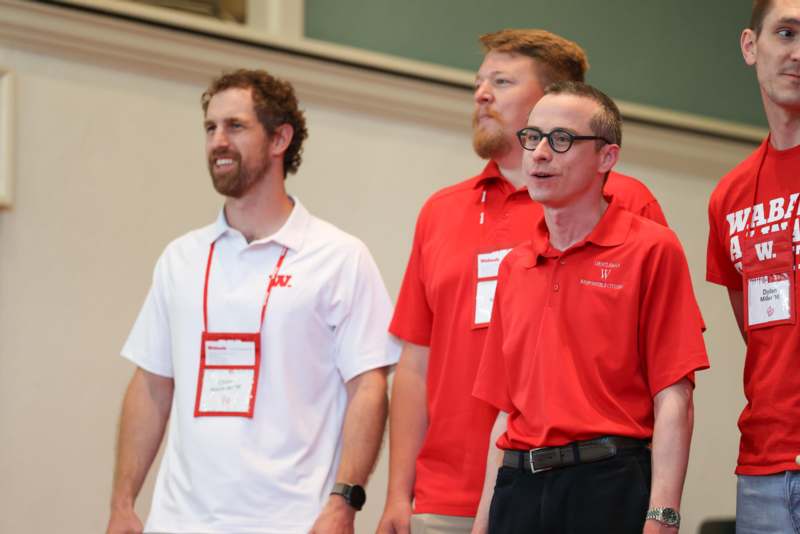 a group of men wearing red shirts