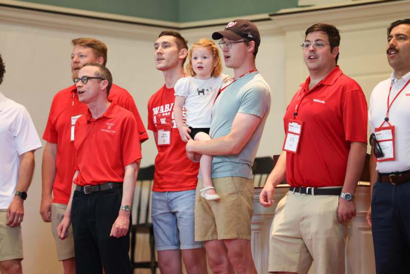 a group of people standing in a room