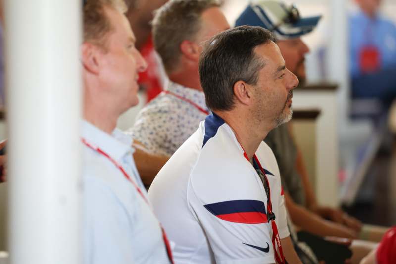 a group of men sitting in a row