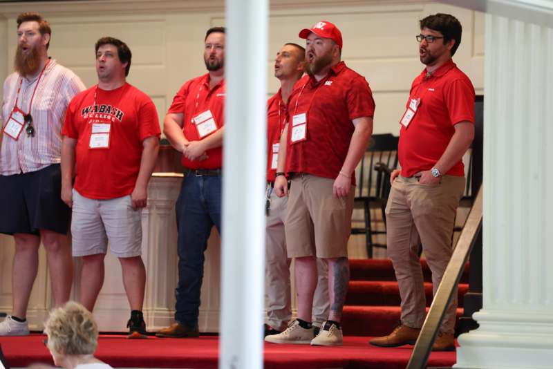 a group of men wearing red shirts