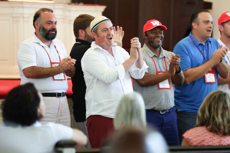 a group of people clapping
