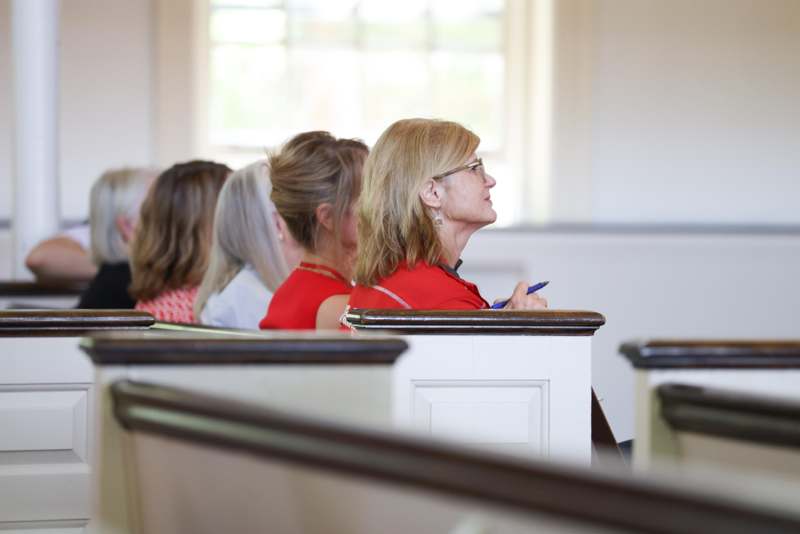a group of women sitting in pews