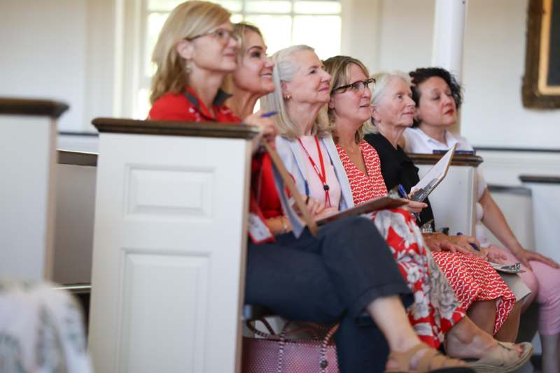 a group of women sitting in pews