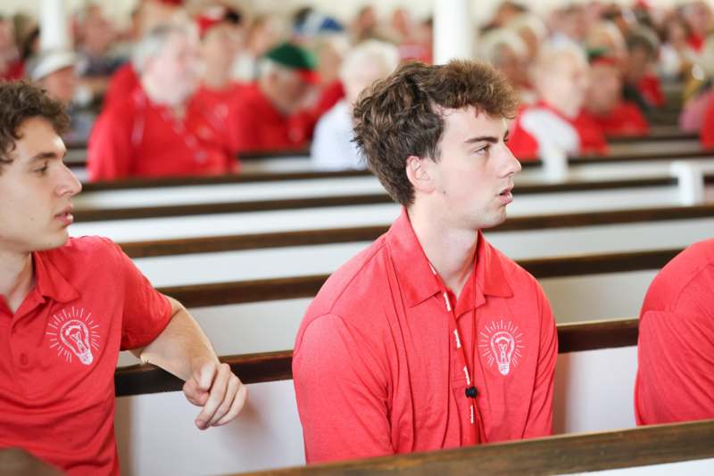 a group of people sitting in pews