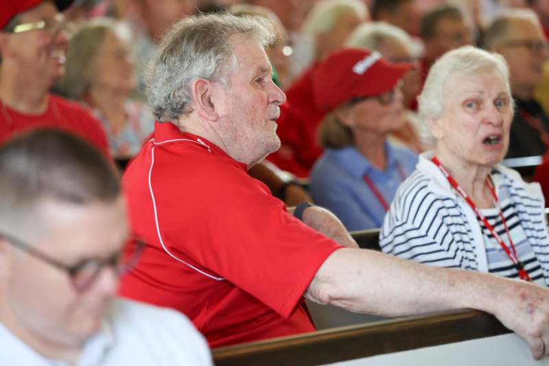 a group of people sitting in pews
