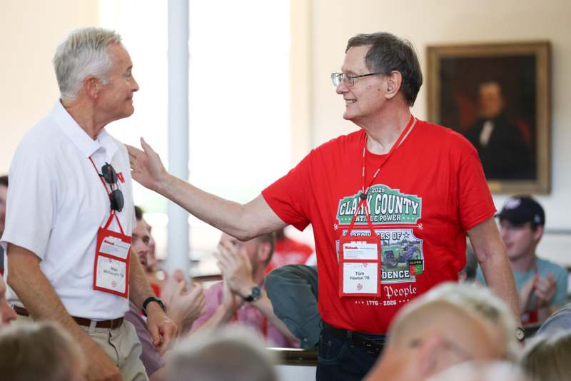 a man in red shirt and white shirt with a man in a red shirt