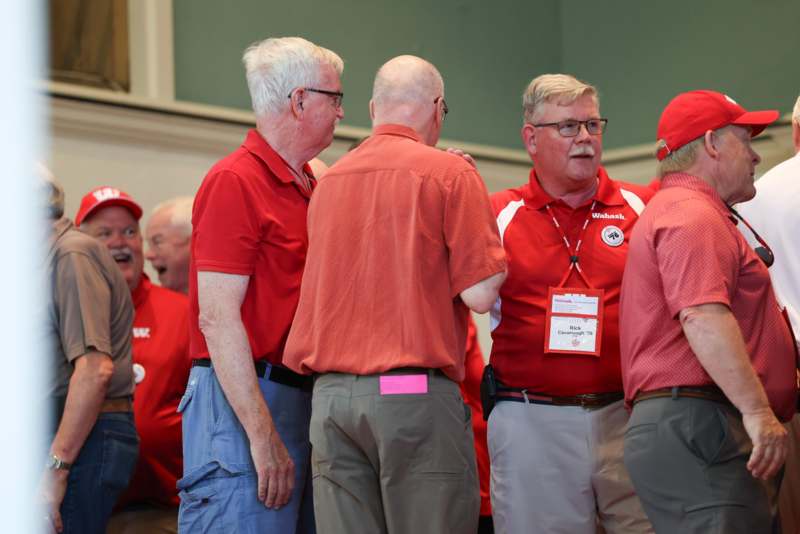 a group of men wearing red shirts