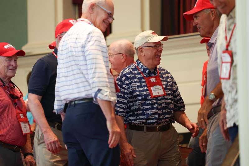 a group of men wearing red hats
