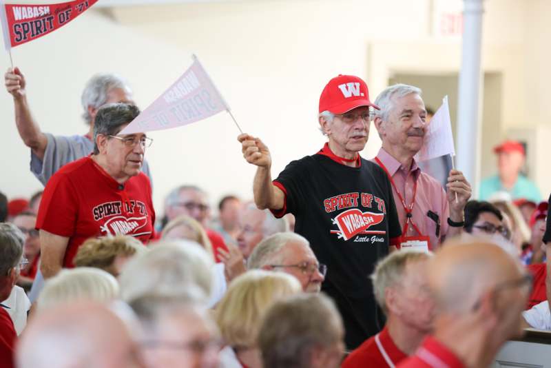 a group of people holding flags