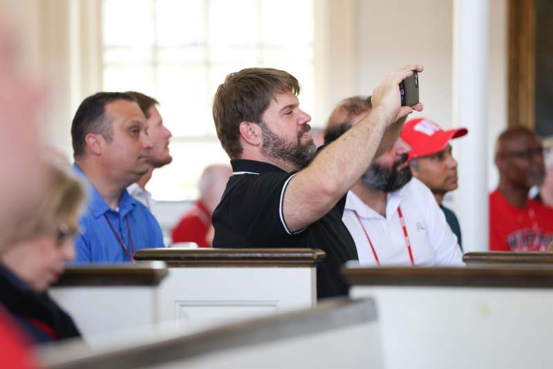 a man taking a selfie with a cellphone