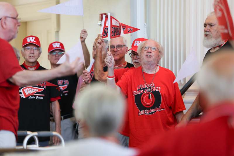 a group of people holding flags